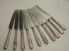 Ten Georgian silver handled dinner knives of moulded form having replacement steel blades by