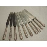Ten Georgian silver handled dinner knives of moulded form having replacement steel blades by