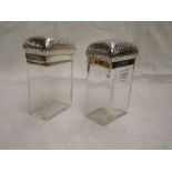 Two Victorian glass toiletry pots of tall rectangular form having plannished tops with monogrammed