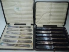 A cased set of silver handled butter knives having moulded decoration, Sheffield 1919, Yates