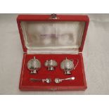 A cased Pakistani silver three piece cruet set of traditional Asian form, retailed by Kashmir Silver
