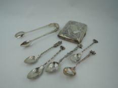 A small selection of HM silver and white metal including a cigarette case, sugar tongs and five