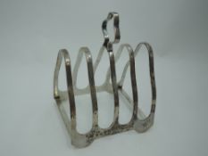 A silver toast rack of arched triangular form, Birmingham 1914, Elkington & Co, approx 71g