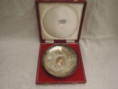 A 1960's cased silver Churchill pin dish bearing a Churchill commemorative crown to base and over