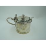 A Victorian silver mustard pot of plain cylindrical form having gadrooned rim and scallop shell