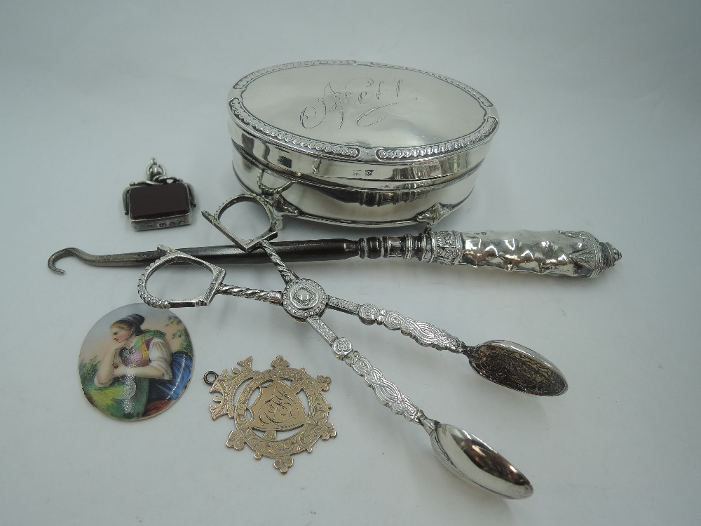 A small selection of HM silver including oval silver trinket box having hinged lid inscribed 'Nell',