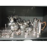 A selection of silver plate including four piece tea set, coffee pot, toast rack, mustard pot etc