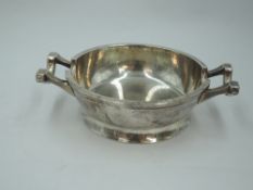 A silver ash tray of heavy bowl form having plannished finish, London 1946, Francis Adam, approx