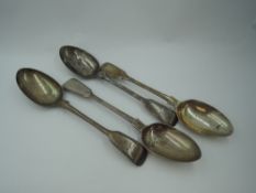 Four Victorian silver table spoons of fiddle back form having reeded decoration to rims and engraved