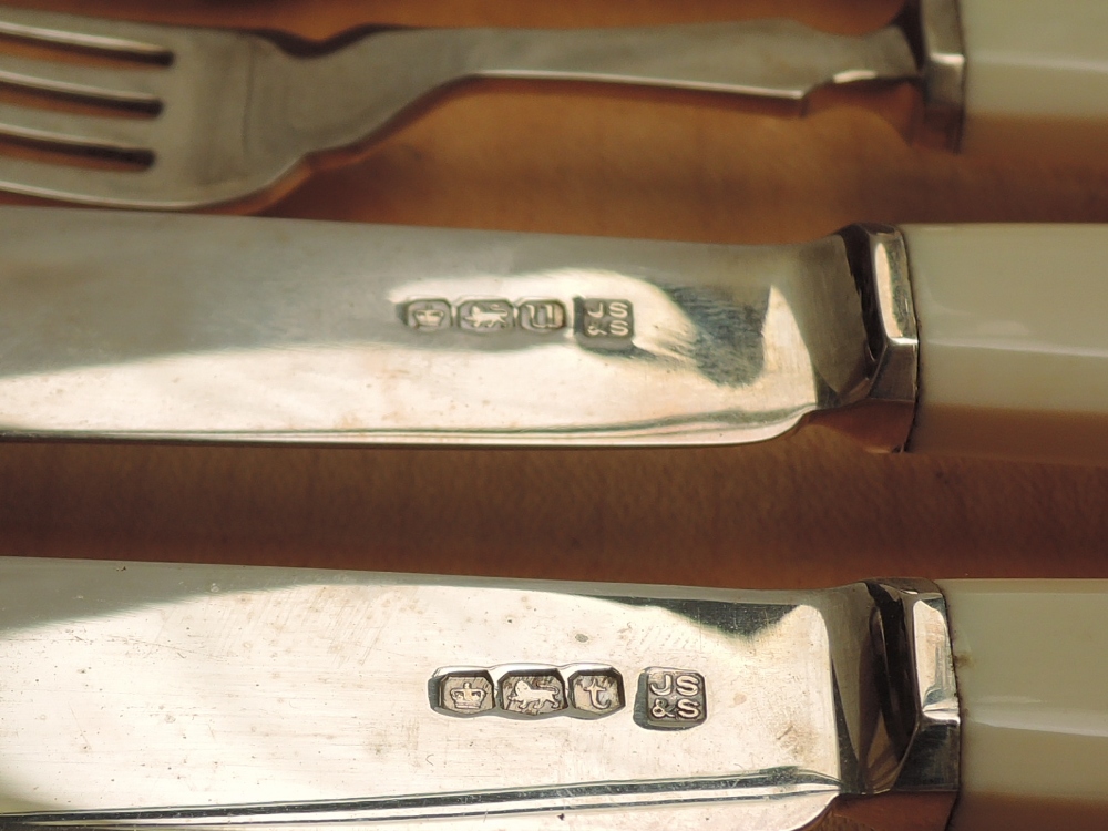 A 1930's cased eight place set of silver fish knives and forks having ivory handles, Sheffield 1937, - Image 2 of 3