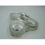 A glass dressing table nail buffer holder with integrated silver lidded pot bearing monogram G,