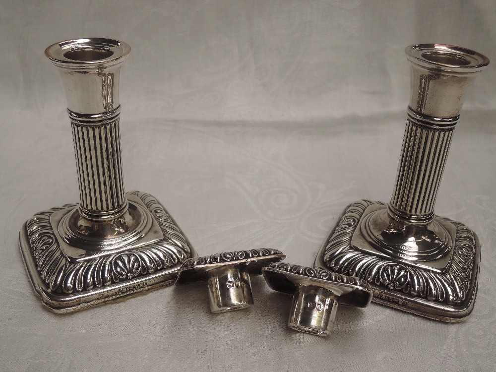 A pair of Edwardian silver candlesticks of squat Corinthian form having weighted bases, Birmingham - Image 2 of 2