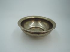 A middle Eastern white metal bowl stamped 900AG having central decorative panel to base, approx 70g