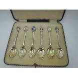 A cased set of six silver coffee spoons having enamelled terminals commemorating the Silver