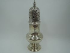 A Georgian silver sugar caster of baluster form having push on domed lid with pierced decoration,