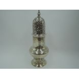 A Georgian silver sugar caster of baluster form having push on domed lid with pierced decoration,