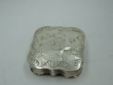 A French silver pill box of canted square form having brightcut and engraved decoration and gilt