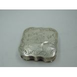 A French silver pill box of canted square form having brightcut and engraved decoration and gilt