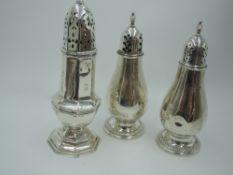 An HM silver sugar caster of waisted octagonal form, marks worn and a large pair of American