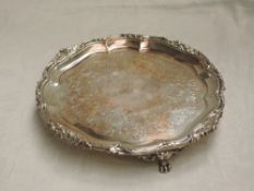 A Victorian silver salver having moulded scroll rim, engraved floral decoration and trefoil scroll