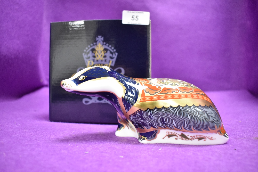 A ceramic Royal Crown Derby paper weight or figure of a Moonlight Badger having Gold stopper and