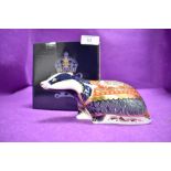 A ceramic Royal Crown Derby paper weight or figure of a Moonlight Badger having Gold stopper and