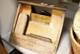 A vintage shoe shine stand and carry case by Kiwi with contents