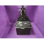 A gothic styled church collection box having a Black Forest style design with wrought iron