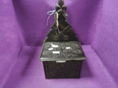 A gothic styled church collection box having a Black Forest style design with wrought iron