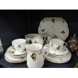 An art deco designed part tea service by S . Hancock & Sons in the Cockatoo pattern