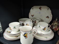 An art deco designed part tea service by S . Hancock & Sons in the Cockatoo pattern