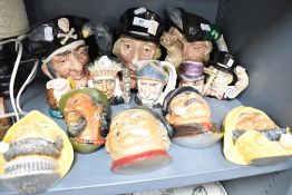 A selection of chalk ware plaques and character mugs including Royal Doulton and Legend Products