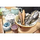 A selection of table and bake wares including cream pot cutlery and Denby jug