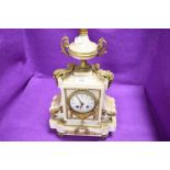 An antique French styled mantle clock having marble case with ormolu decals