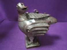 An Indian made cast metal storage container or tobacco jar in the form of a bird