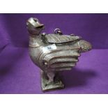 An Indian made cast metal storage container or tobacco jar in the form of a bird