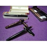 A selection of stationary ink and ball point pens including Burnham Shaeffers and Parker