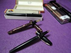 A selection of stationary ink and ball point pens including Burnham Shaeffers and Parker