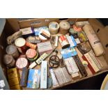 A selection of pharmacy and chemist bottles, tins and packets