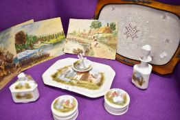 An antique porcelain dressing table set in fine condition hand decorated with cottage scenes with
