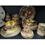 A selection of tea and coffee wares by Royal Worcester being hand decorated by various artists