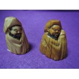 A pair of scrimshaw style carved figures possibly marine ivory in an oriental style having good