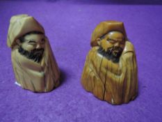 A pair of scrimshaw style carved figures possibly marine ivory in an oriental style having good