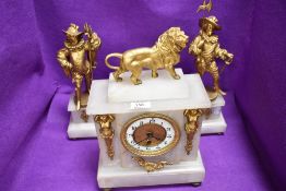 An impressive marble and ormolu mantle clock and garniture set having conquistador figures and