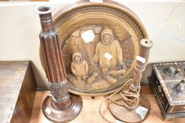 A mid century wall plaque depicting Inuit life and two hand carved lamp bases one being folk art