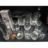 A selection of clear cut crystal glass wares including etched glasses and Scottish paper weight