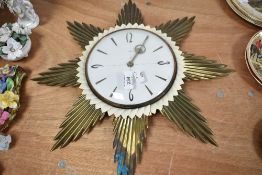 A mid century starburst styled wall clock by Metamec