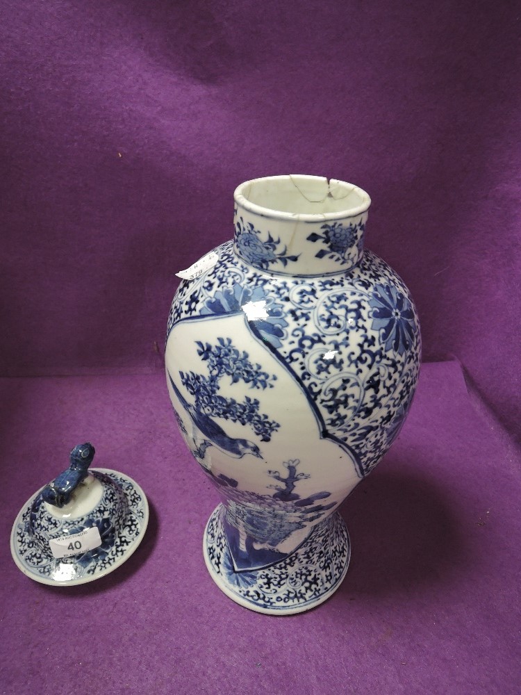 A hand decorated Chinese export porcelain lidded vase depicting bird and foliage 33cm tall