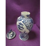 A hand decorated Chinese export porcelain lidded vase depicting bird and foliage 33cm tall