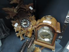 Two clocks including wall mounted German style cuckoo clock and Tempus Fugit mantle clock